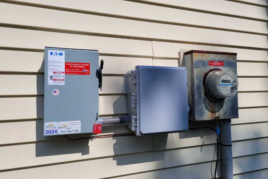 solar meter boxes on side of home