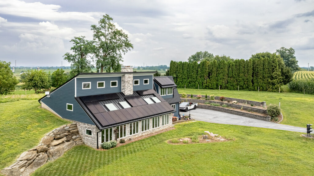Wide aerial shot House in with 33 kW of solar panels installed facing south in Lancaster county