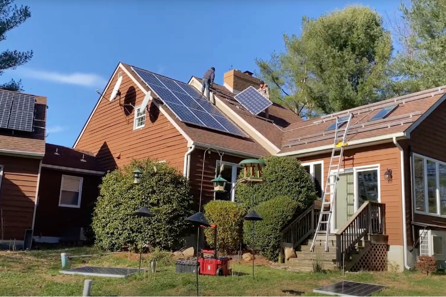 new solar panels being added alongside existing solar panel array