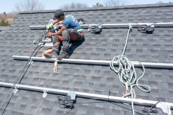 installing solar panels on a roof